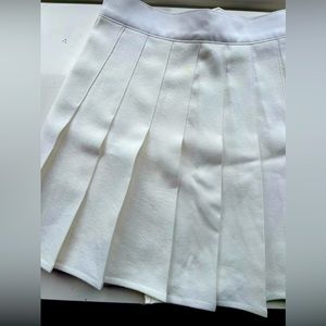 Pleated white mini skirt